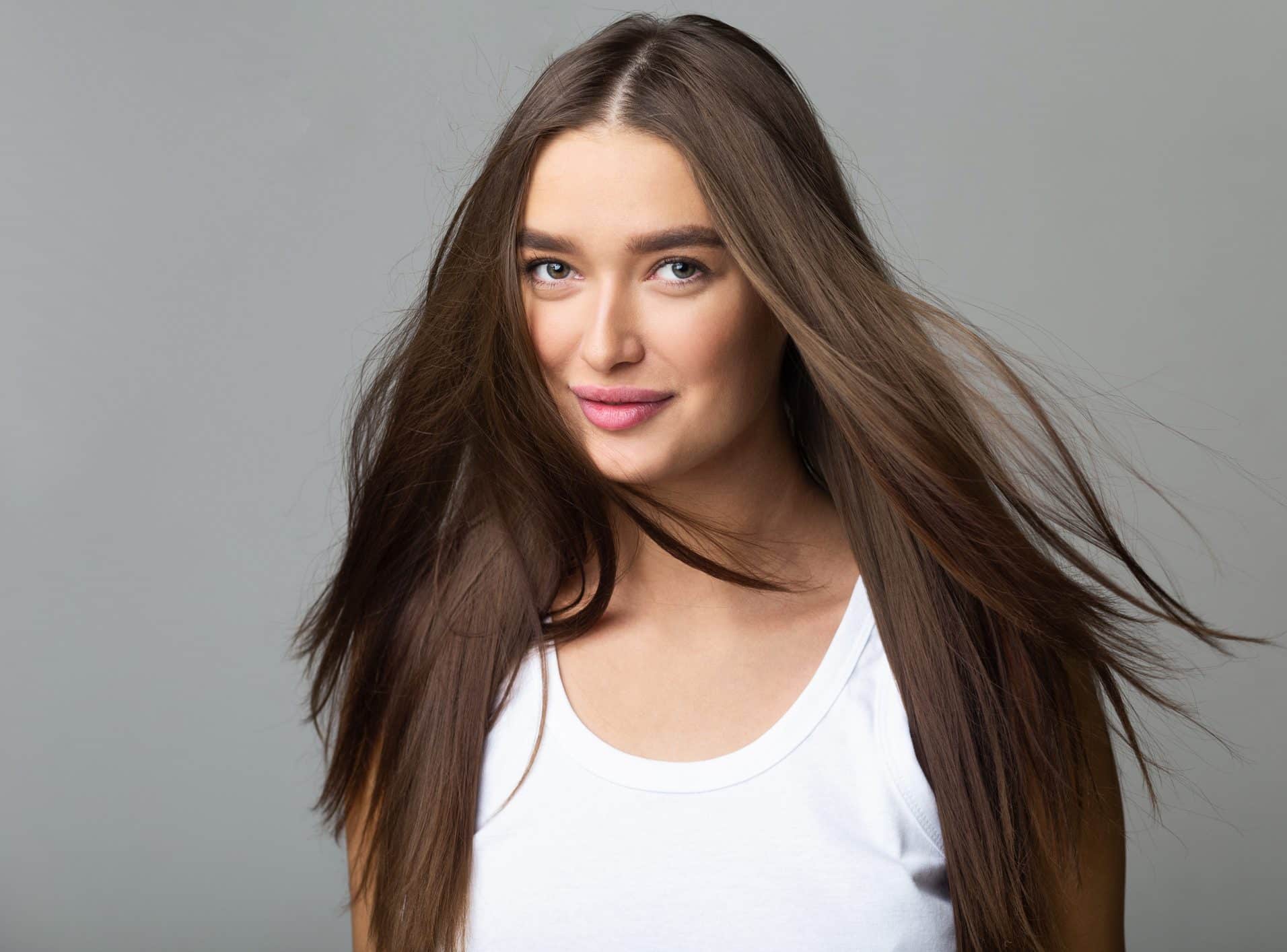 Young Girl with Long Flying Hair, Grey Background